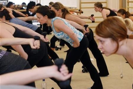 Women participate in exercises during a fitness class at The Bar Method in New York, in this picture taken March 28, 2011.