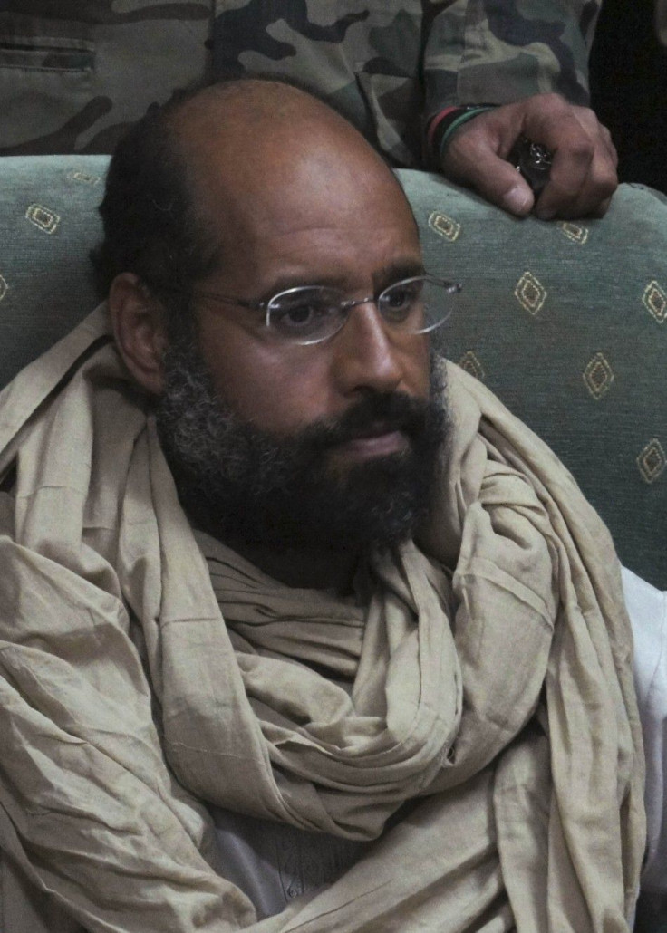Saif al-Islam is seen after his capture, in the custody of revolutionary fighters in Obari, Libya