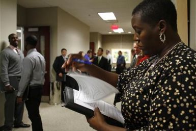 Lee Ann Parham fills out paper work during the Chase Bank Veterans Day job fair in Phoenix