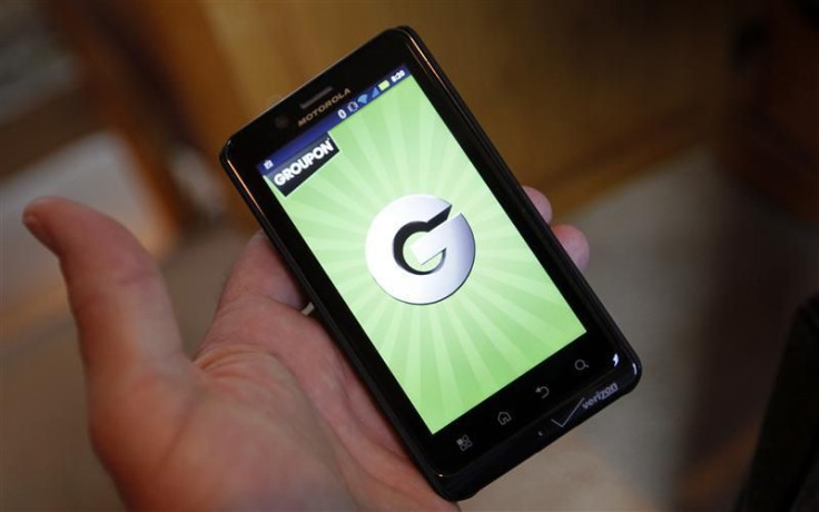 The Groupon smartphone app is displayed on a Motorola Droid Bionic cell phone in Denver
