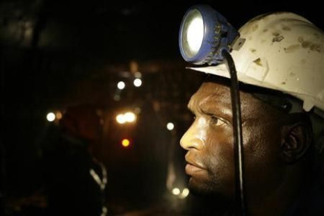 A mine worker looks on underground in Modderfontein east mine