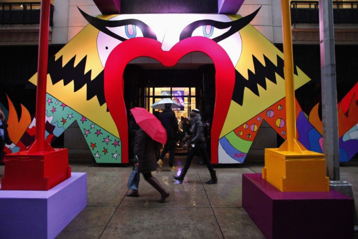 People pass by the display of Gaga's Workshop at luxury department store Barneys in New York