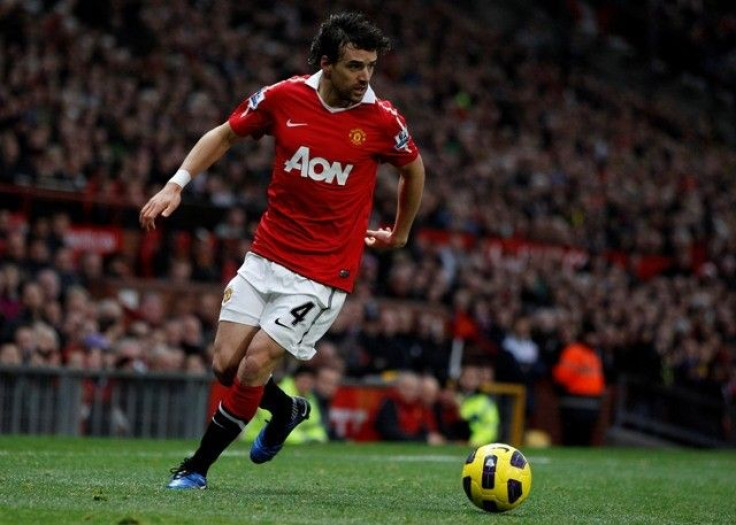 Manchester United-s Hargreaves runs with the ball during their English Premier League soccer match against Wolverhampton Wanderers at Old Trafford in Manchester .