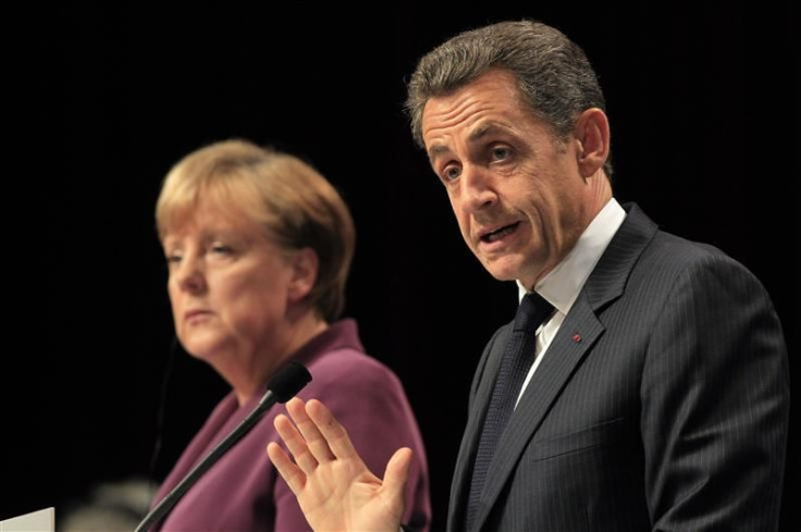 France's President Sarkozy and Germany's Chancellor Merkel attend a joint press conference after crisis talks on the eve of a G20 summit of major world economies in Cannes