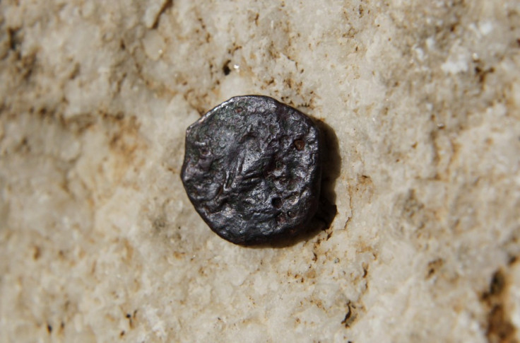 An ancient coin is displayed at an excavation site of an ancient Jewish Mikve, or ritual bath, underneath the Western Wall in Jerusalem's Old City November 23, 2011. REUTERS/Ronen Zvulun