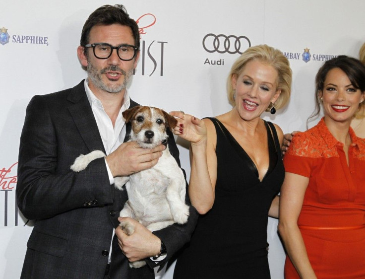 French director Michel Hazanavicius (L) poses with Uggie the dog and cast members Penelope Ann Miller and Berenice Bejo (R) at a special screening of their film &quot;The Artist&quot; in Beverly Hills, California 