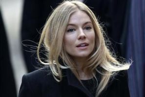 British actress Sienna Miller arrives at the Leveson Inquiry into media practices at the High Court in central London November 24, 2011.