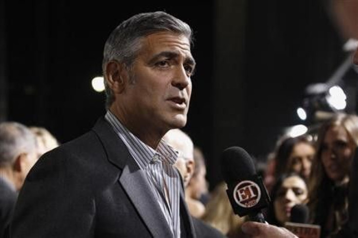 Cast member George Clooney is interviewed at the premiere of ''The Descendants'' at the Samuel Goldwyn Theater in Beverly Hills, California November 15, 2011.