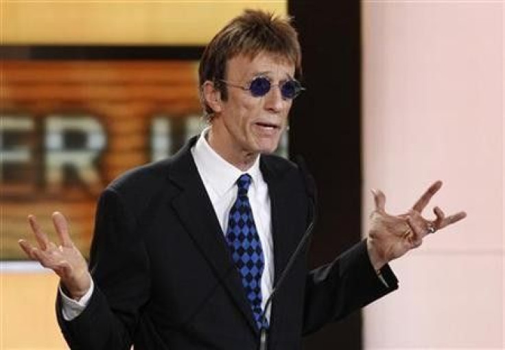 British musician Robin Gibb prepares to present U.S.actor John Travolta the award for best international actor during the 46th &#039;Goldene Kamera&#039; (Golden Camera) awards ceremony at the Ullstein Auditorium in Berlin, February 5, 2011.