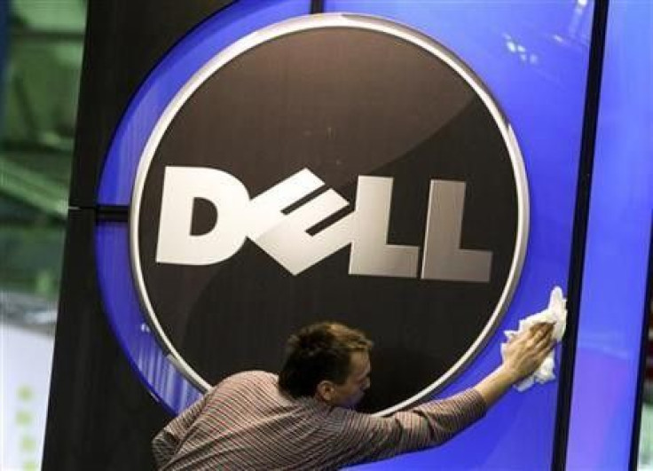 A man wipes the logo of the Dell IT firm at the CeBIT exhibition centre in Hannover