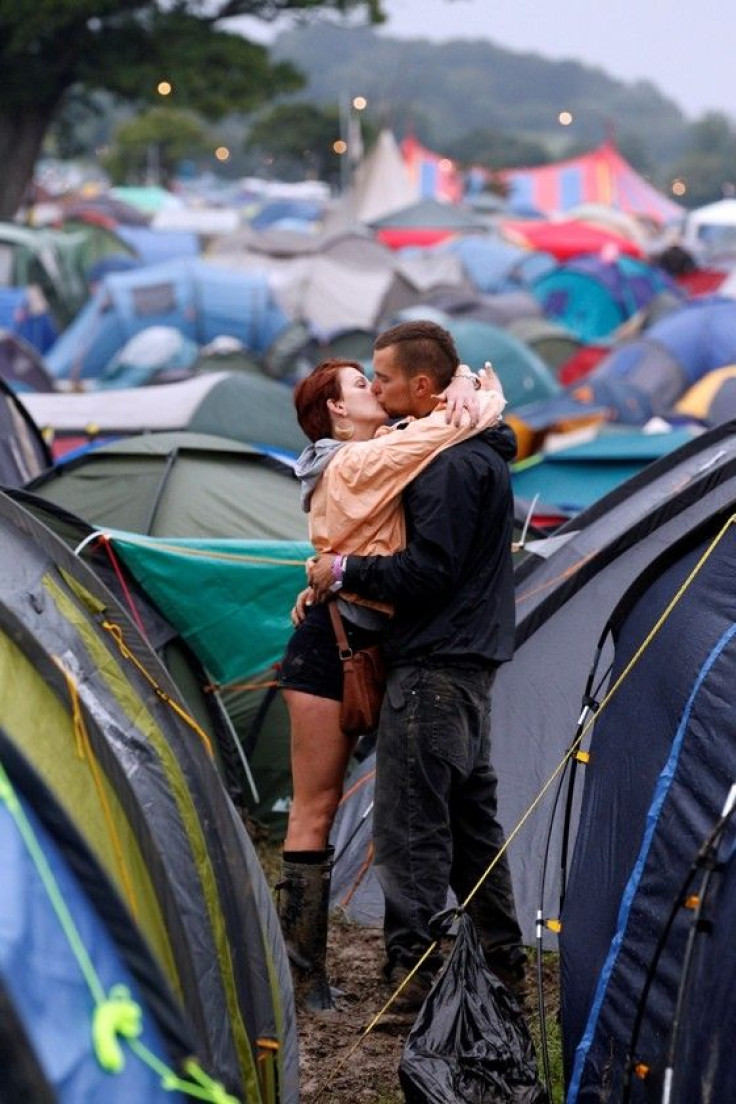 A couple embrace on the third day of the Glastonbury Festival in Somerset