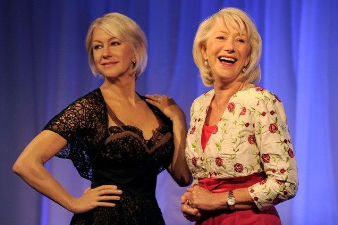 British actress Helen Mirren poses for photographers next to her wax model at Madame Tussauds in London 
