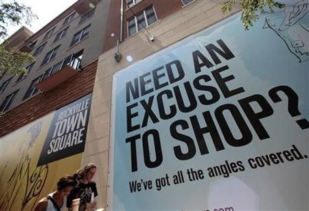 Shoppers walk through Rockville Town Square in Maryland