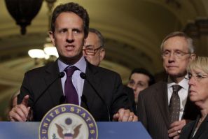 Timothy Geithner speaks to the media next to Harry Reid after his meeting about the debt limit on Capitol Hill in Washington