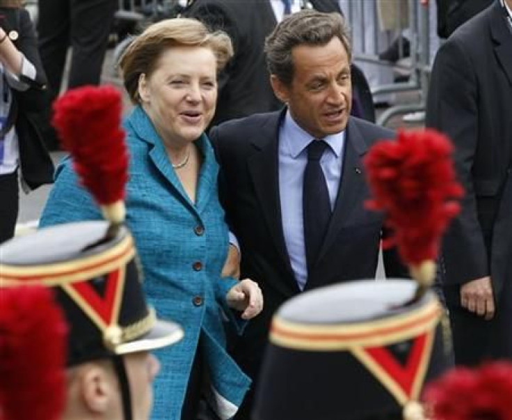 German Chancellor Angela Merkel is welcomed by French President Nicolas Sarkozy gesture to G8 Summit in France