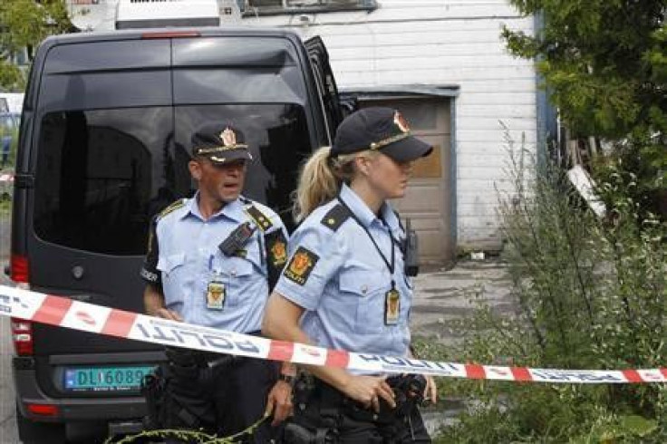 Armed police are seen at an address in the east of Oslo