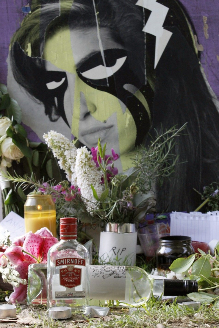 Flowers and tributes are seen outside the home of Amy Winehouse in London