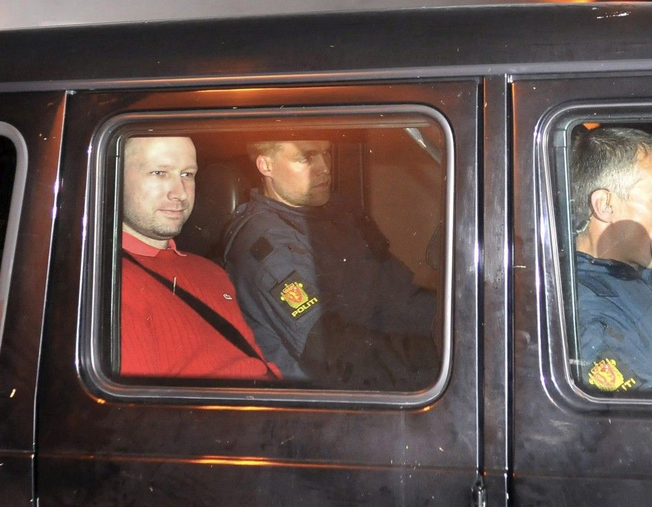 Norwegian Breivik, man accused of a killing spree and bomb attack in Norway, sits in the rear of a vehicle as he is transported in a police convoy in Oslo