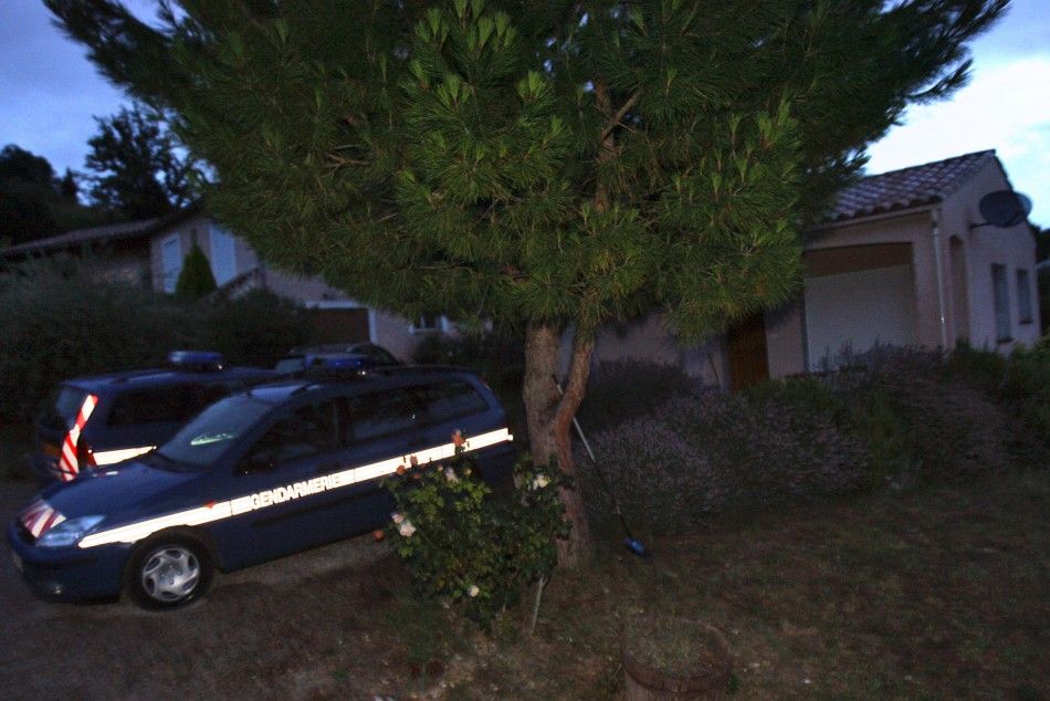 Cars of French gendarmes stand in front of the house of Jens Breivik, the father of Anders Behring Breivik, in Cournanel, southern France