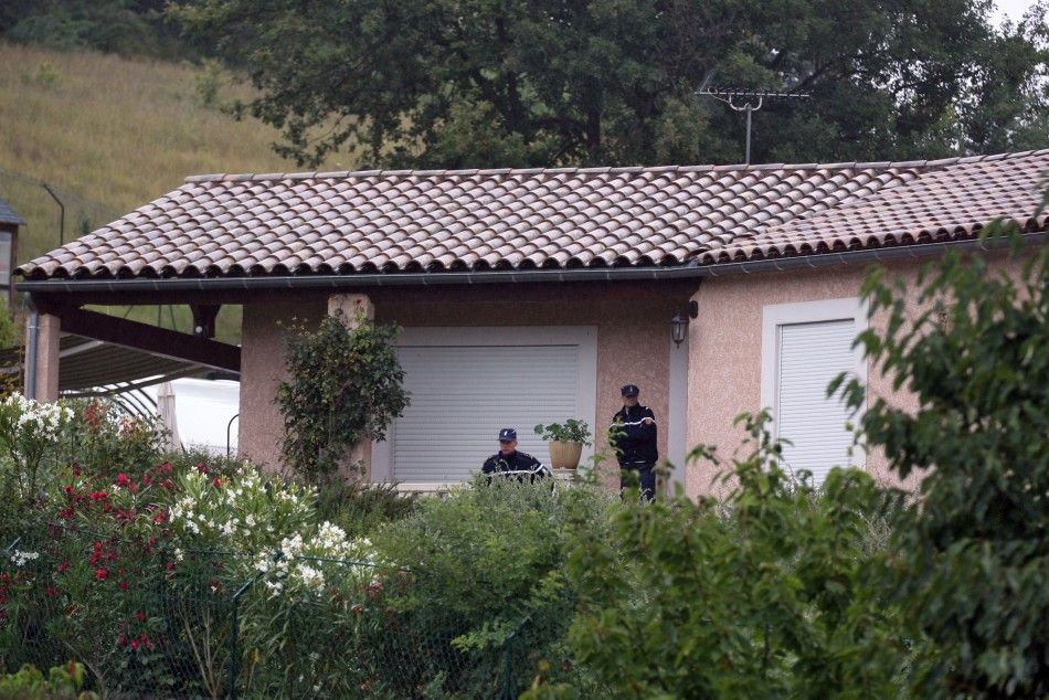 French gendarmes stand in front of the house of Jens Breivik, the father of Anders Behring Breivik in Cournanel