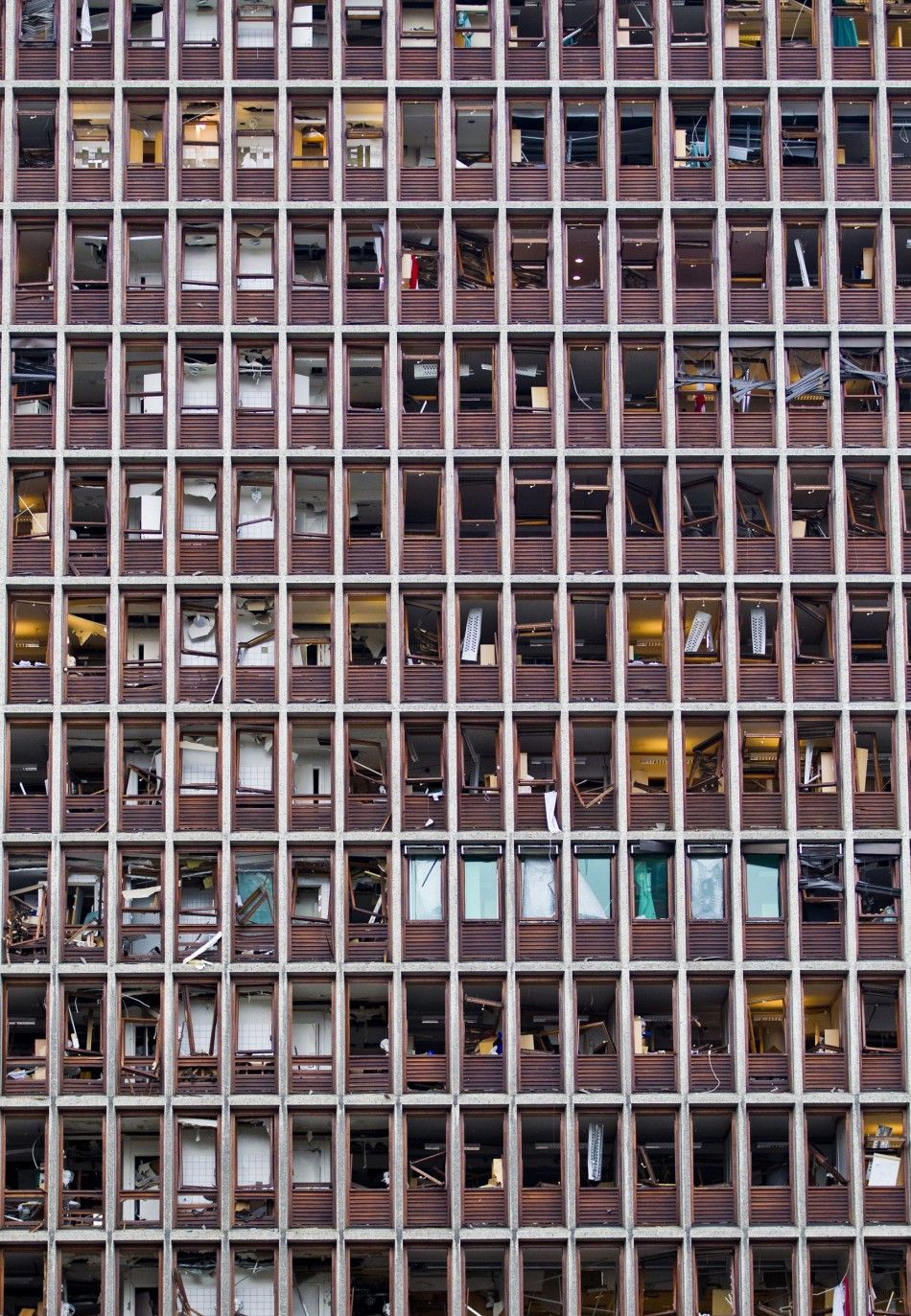 The shattered windows of a government building are seen in Oslo