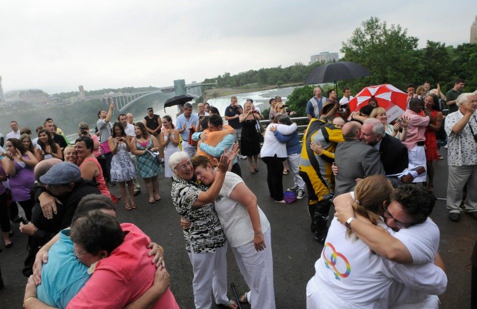 Forty six couples are wed in a large same-sex ceremony, near the brink of Niagara Falls, in Niagara Falls