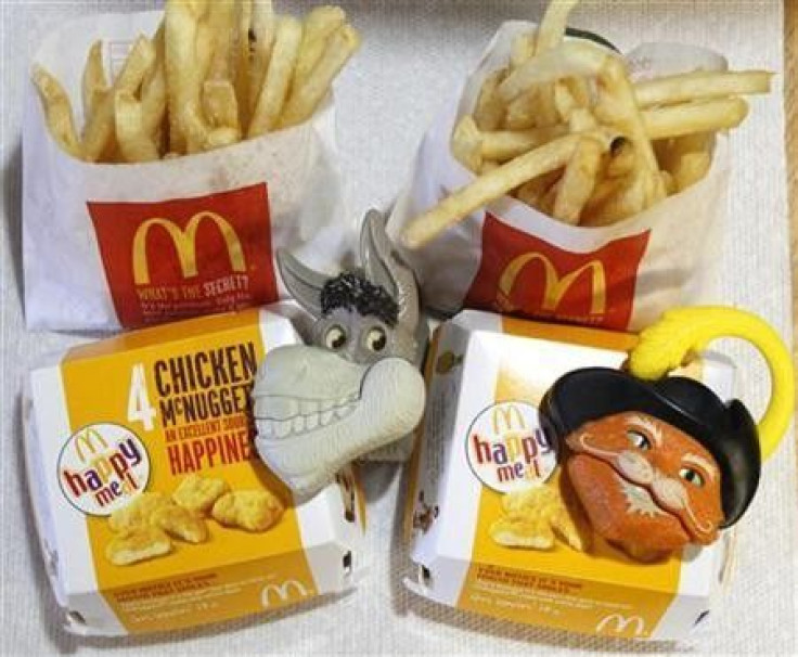 Two McDonald&quot;s Happy Meal with toy watches fashioned after the characters Donkey and Puss in Boots from the movie &quot;Shrek Forever After&quot;