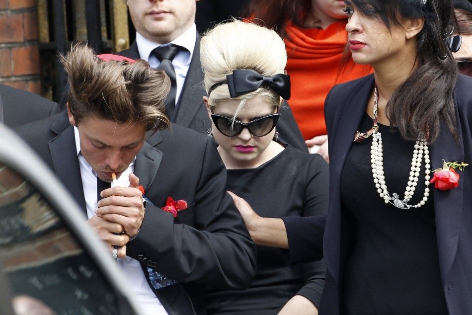 Kelly Osbourne leaves Golders Green Crematorium with other mourners after the cremation of British singer Amy Winehouse, in north London
