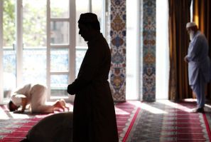Muslim men pray at the World Islamic Mission Mosque in Oslo