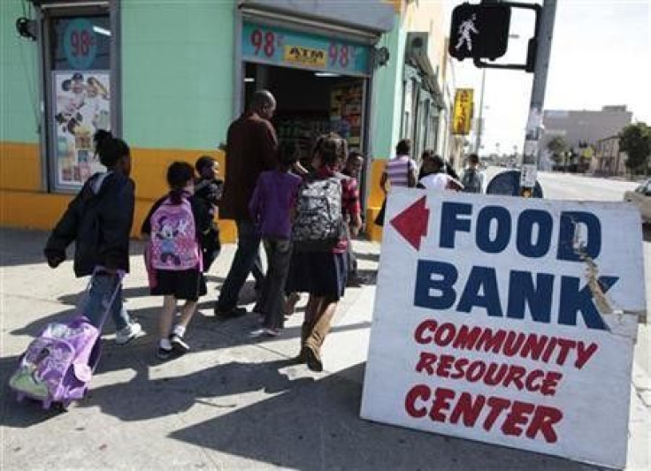 Regional coordinator Charles Evans (4th L) picks up children from school to take them to an after-school program at South Los Angeles Learning Center in Los Angeles