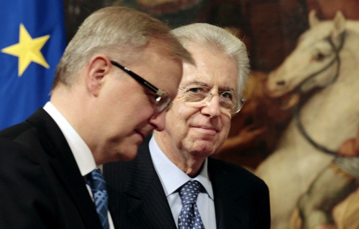 Italy's Prime Minister Mario Monti looks on as he meets European Union Economic and Monetary Affairs Commissioner Olli Rehn at the Chigi Palace in Rome