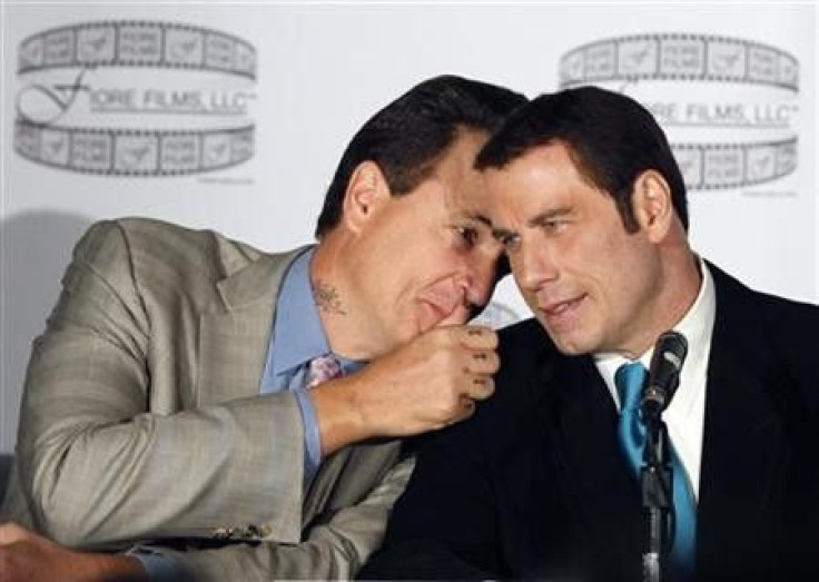 Director Nick Cassavetes (L) talks with actor John Travolta during a news conference to promote the film &#039;&#039;Gotti:Three Generations&#039;&#039; in New York
