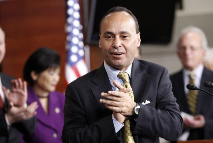 US Representative Luis Gutierrez applauds at a news conference to celebrate the passage of the &quot;Dream Act&quot; in the House of Representatives in Washington