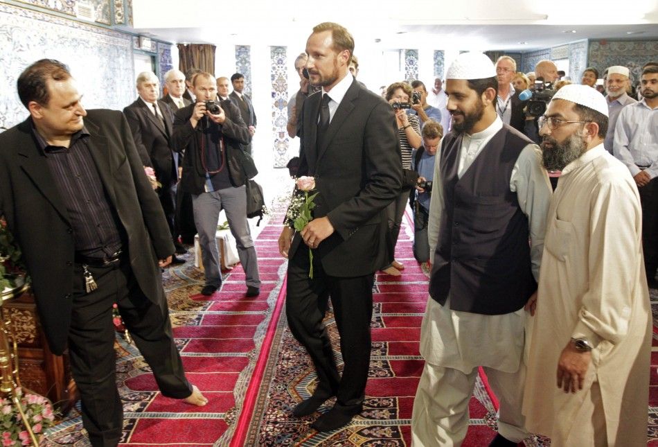 Norways Crown Prince Haakon is welcomed inside the World Islamic Mission Mosque in Oslo