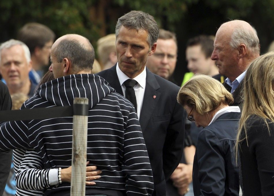 Norwegian King Harald, Queen Sonja and Prime Minister Jens Stoltenberg comfort survivors and family members at a hotel in Sundvollen, northwest of Oslo
