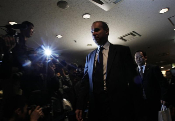 Former Olympus CEO Michael Woodford leaves after his news conference about the Olympus's scandal in Tokyo