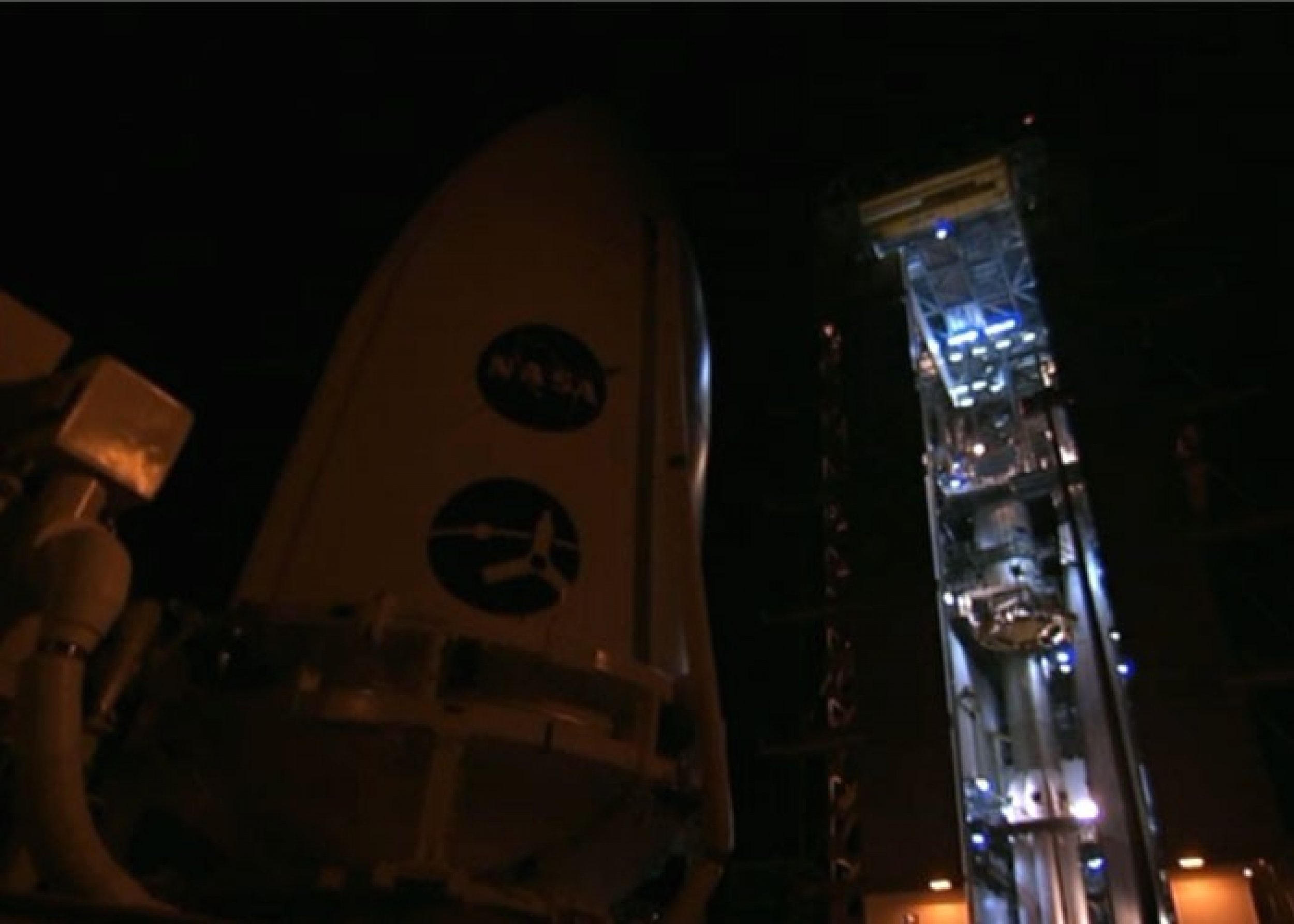 Jupiter probe Juno, which rests inside a part of Atlas V rocket, is being carried to the launch pad