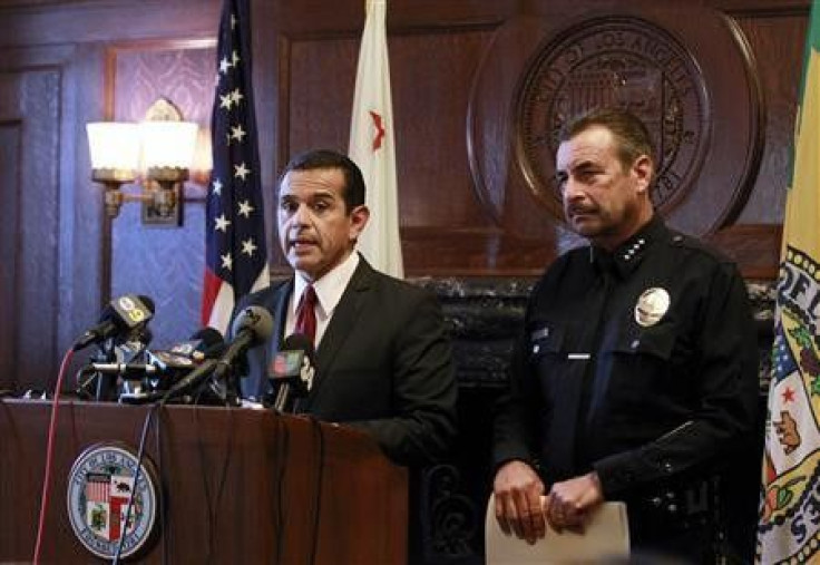 Los Angeles Mayor Antonio Villaraigosa (L) speaks next to LAPD Chief Charlie Beck during a media conference in Los Angeles City Hall as the Occupy LA protest camp continues outside