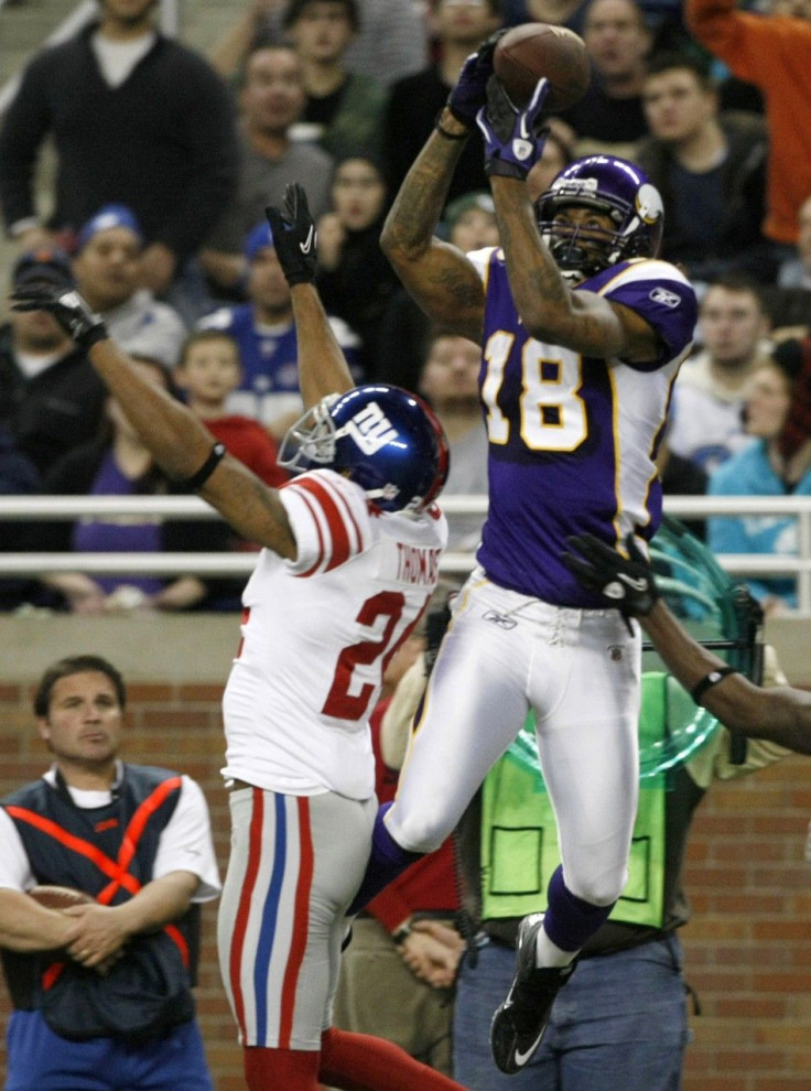 Minnesota Vikings Rice catches a pass defended by New York Giants Thomas during first half of their NFL football game in Detroit