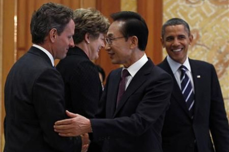 President Barack Obama and South Korea's President Lee Myung-bak greet U.S. Treasury Secretary Timothy Geithner and U.S. Ambassador to Korea Kathleen Stephens in Seoul