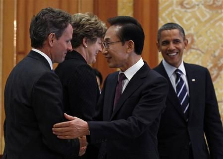President Barack Obama and South Korea's President Lee Myung-bak greet U.S. Treasury Secretary Timothy Geithner and U.S. Ambassador to Korea Kathleen Stephens in Seoul