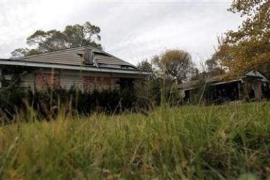 An abandoned and dilapidated home, one of 32 abandoned properties in the neighborhood listed on the auction block during the Wayne County tax foreclosures auction of almost 9,000 properties is seen in Detroit, Michigan, October 21, 2009.