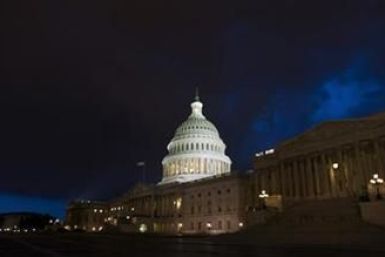 Storm clouds gather above the U.S. Capitol in Washington