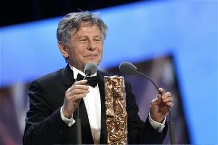 Director Roman Polanski reacts after winning the Best Director award