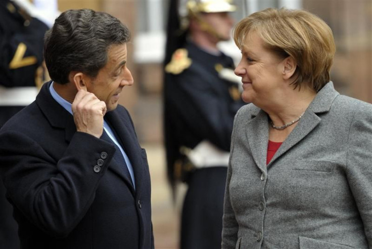 France's President Sarkozy welcomes German Chancellor Merkel at a meeting in Strasbourg