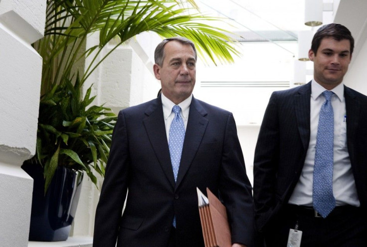 House Speaker John Boehner departs the Republican caucus meeting on Capitol Hill in Washington
