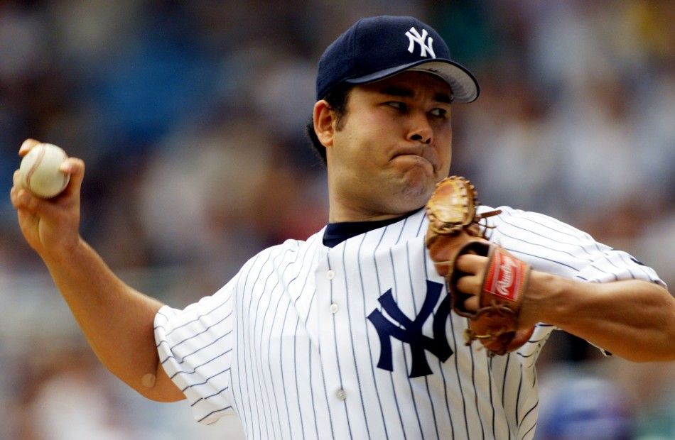 New York Yankees starting pitcher Hideki Irabu throws against the Toronto Blue Jays in the first inning of their game at New York039s Yankee Stadium, August 4. Irabu entered the game with a record of eight wins and three losses and an earned run averag