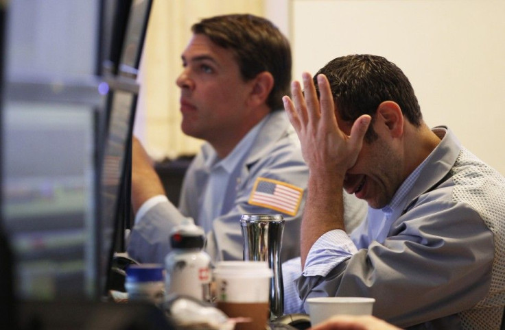 Traders work on the floor of the New York Stock Exchange in New York