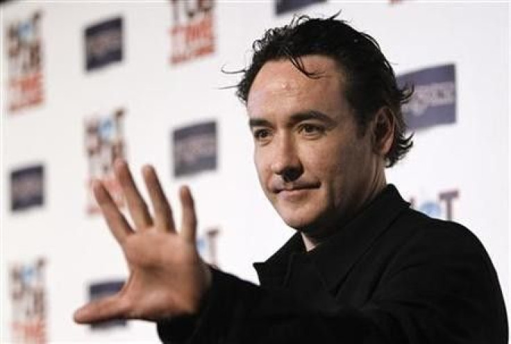 John Cusack waves at the premiere of ''Hot Tub Time Machine'' in Hollywood, California