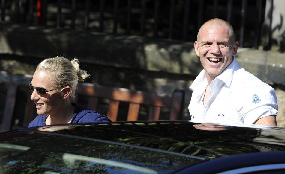 Britains Zara Phillips L, the eldest granddaughter of Queen Elizabeth and England rugby captain Mike Tindall R, arrive for their wedding rehearsal, at Canongate Kirk in Edinburgh, Scotland 
